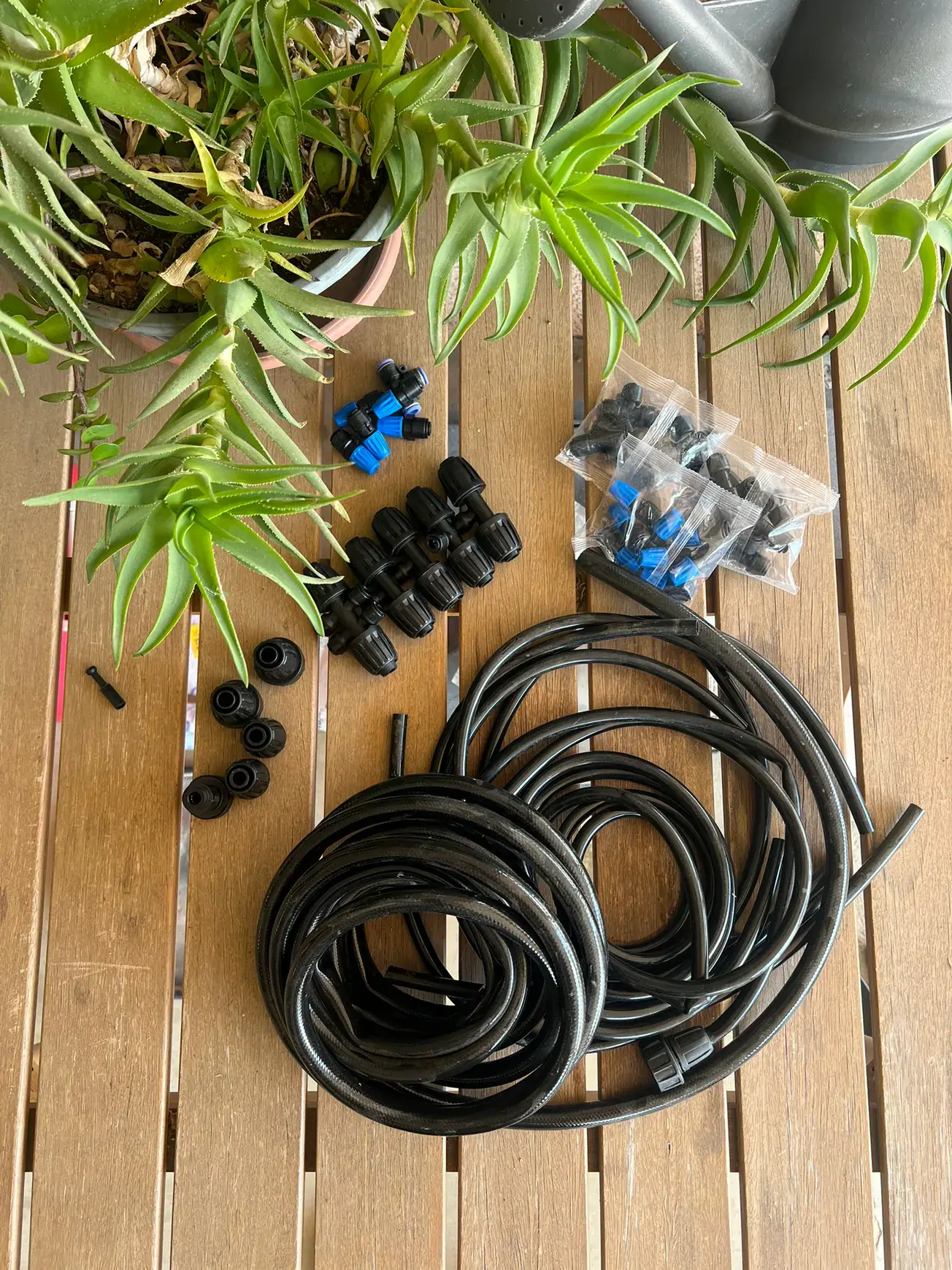 Irrigation tubing, splitters, and fittings arranged for garden installation